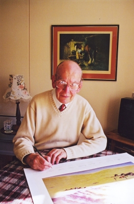 Signing the art print <i>Returning from Caen</i> by Graeme Lothian.