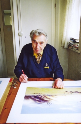 Signing the art print <i>Returning from Caen</i> by Graeme Lothian.